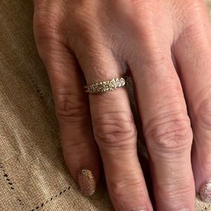 Solitaire with a ring guard. Could be used as a promise ring or right hand ring
